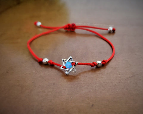 Fine red string bracelet